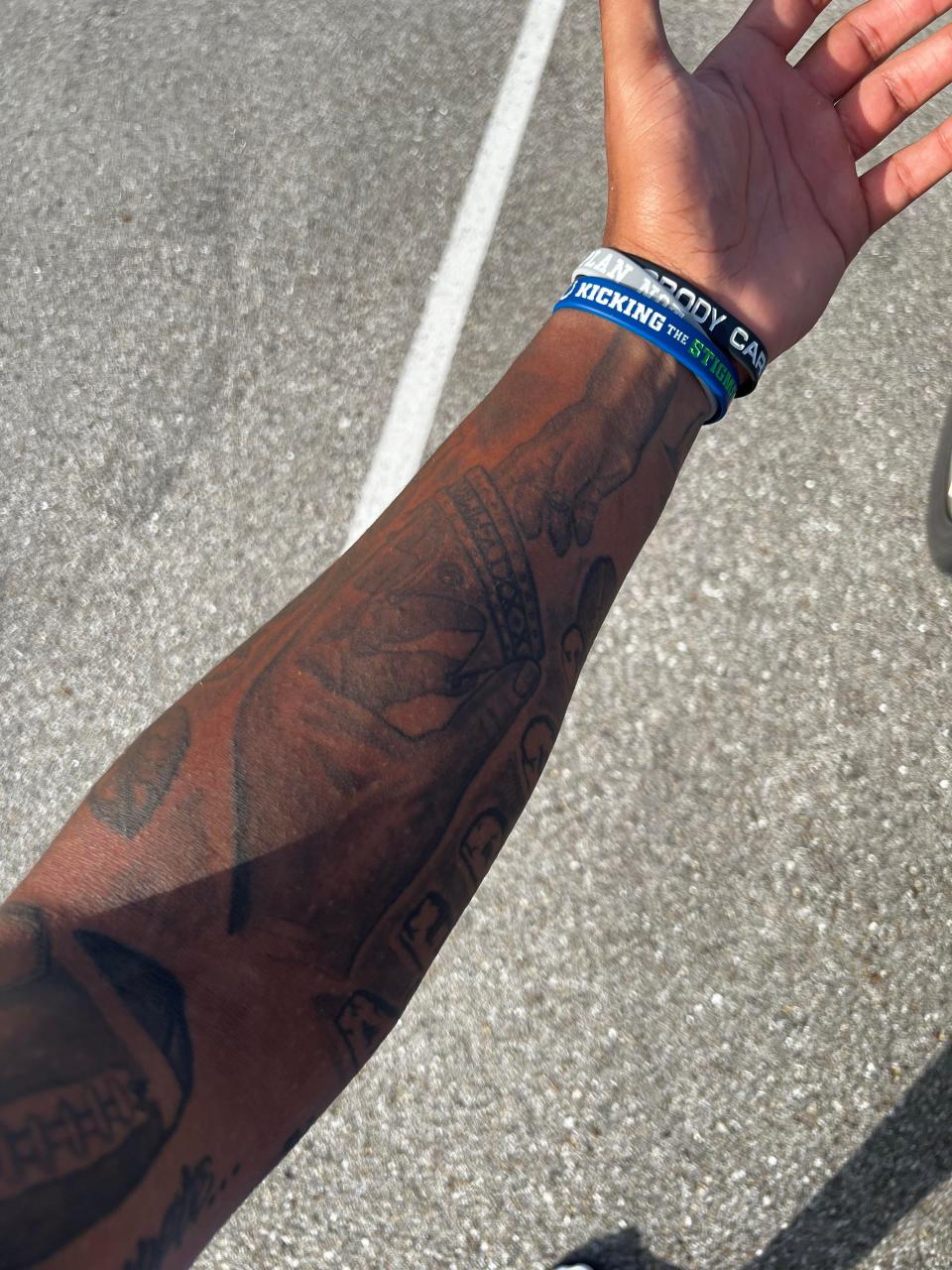 On his left forearm, Indianapolis Colts tight end Drew Ogletree has a tattoo depicting him passing a crown to his son, Andrew Jr. “I’m handing him the crown of knowledge that I’ve learned in my life and letting him run away with whatever he learns from it," Ogletree said.