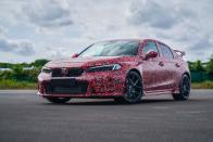 <p>Honda confirmed that a <a href="https://www.caranddriver.com/news/a34848360/2022-honda-civic-type-r-details/" rel="nofollow noopener" target="_blank" data-ylk="slk:new Civic Type R;elm:context_link;itc:0;sec:content-canvas" class="link ">new Civic Type R</a> is on the way, and it should have a more mature look as previewed by a <a href="https://www.caranddriver.com/news/a37848724/2022-honda-civic-type-r-teaser/" rel="nofollow noopener" target="_blank" data-ylk="slk:photos of a camouflaged prototype model;elm:context_link;itc:0;sec:content-canvas" class="link ">photos of a camouflaged prototype model</a>. The second red-badged Civic to arrive in the U.S. will have a more powerful turbocharged 2.0-liter four-cylinder under the hood—hopefully with a better soundtrack—mated to a six-speed manual gearbox, and Honda didn't rule out a quick-shifting dual-clutch transmission, either. We've heard rumors about a hybrid all-wheel-drive powertrain, but we think it's unlikely—at least at launch, which should be sometime in 2022.</p><p><a class="link " href="https://www.caranddriver.com/honda/civic-type-r" rel="nofollow noopener" target="_blank" data-ylk="slk:What We Know So Far;elm:context_link;itc:0;sec:content-canvas">What We Know So Far</a></p>