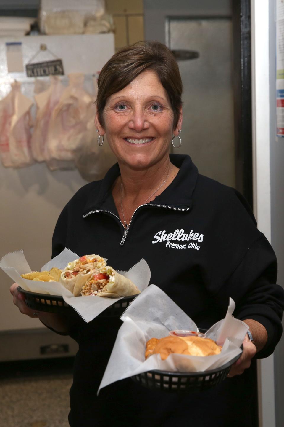 Shelley Hoppes, owner of Shellukes Bar and Grill, will celebrate the business' 20th anniversary Tuesday.