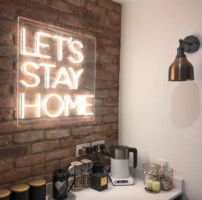 Help a homebody perfect their pad with this on-brand neon sign