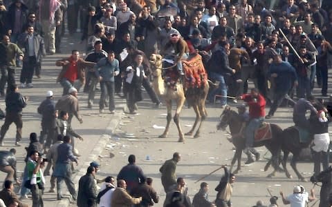 Pro-Mubarak thugs charge into Tahrir Square on February 2, 2011 - Credit: AP Photo/Ben Curtis