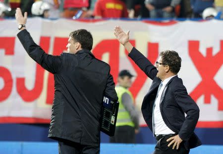 Russia's coach Fabio Capello (R) gestures to his players to leave the pitch during their Euro 2016 Group G qualifying soccer match against Montenegro in Podgorica March 27, 2015. REUTERS/Stevo Vasiljevic