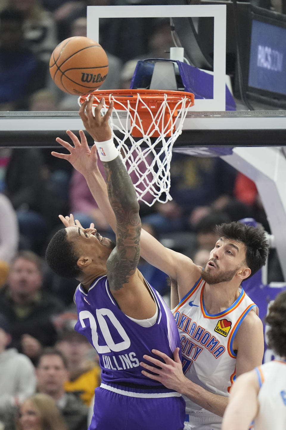 Oklahoma City Thunder forward Chet Holmgren, right, defends against Utah Jazz forward John Collins (20) during the first half of an NBA basketball game Tuesday, Feb. 6, 2024, in Salt Lake City. (AP Photo/Rick Bowmer)