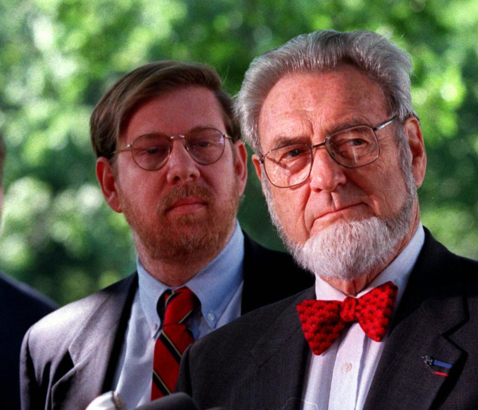Former Surgeon General C. Everett Koop, right, accompanied by former Food and Drug Administration Commissioner David Kessler, meets reporters on Capitol Hill Tuesday May 19,1998 to discuss tobacco legislation and product liability protection. A fleeing spirit of bipartisanship on tobacco legislation exploded on the Senate floor Tuesday when Democrats discovered the Republican leaders wanted to scrap price supports that help tobacco farmers. (AP Photo/William Philpott)