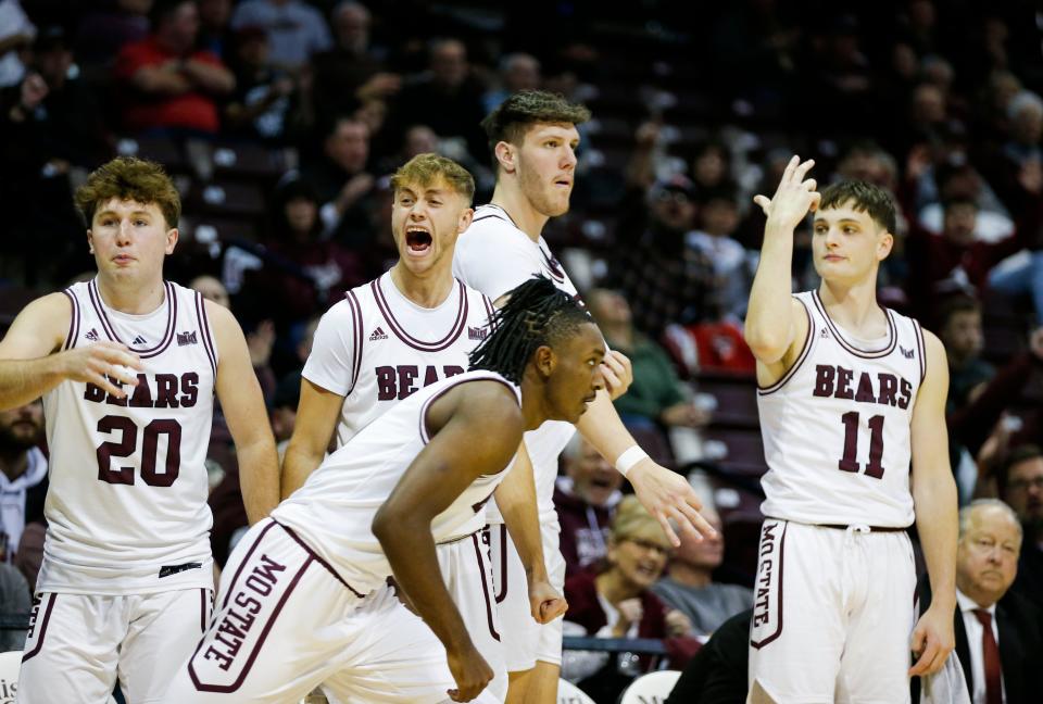 The Missouri State Bears bench celebrates after junior Chance Moore hit a three-pointer as the Bears took on the Evansville Purple Aces at Great Southern Bank Arena on Wednesday, Nov. 29, 2023.