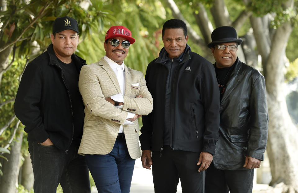In this Tuesday, Feb. 26, 2019 photo, Marlon Jackson, second from left, Jackie Jackson, second from right, and Tito Jackson, far right, brothers of the late musical artist Michael Jackson, and Tito's son Taj, far left, pose together for a portrait outside the Four Seasons Hotel, in Los Angeles. The brothers gave the first family interviews Tuesday on “Leaving Neverland,” which features two Michael Jackson accusers and is set to air on HBO starting Sunday, March 3. (Photo by Chris Pizzello/Invision/AP)