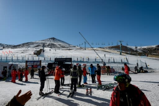 Tourists prepare to ski at El Colorado skiing center