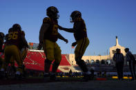 Southern California players warm up prior to an NCAA college football game against Notre Dame Saturday, Nov. 26, 2022, in Los Angeles. (AP Photo/Mark J. Terrill)