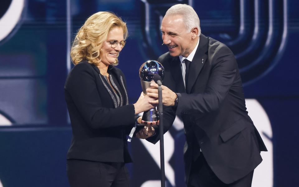 Former Bulgarian soccer player Christo Stoitschkow (R) hands over the Best FIFA Women's Coach Award to Head coach of British National Team Sarina Wiegman (L) on stage during the The Best FIFA Football Awards 2022 ceremony in Paris, - Yoan Valet/Shutterstock