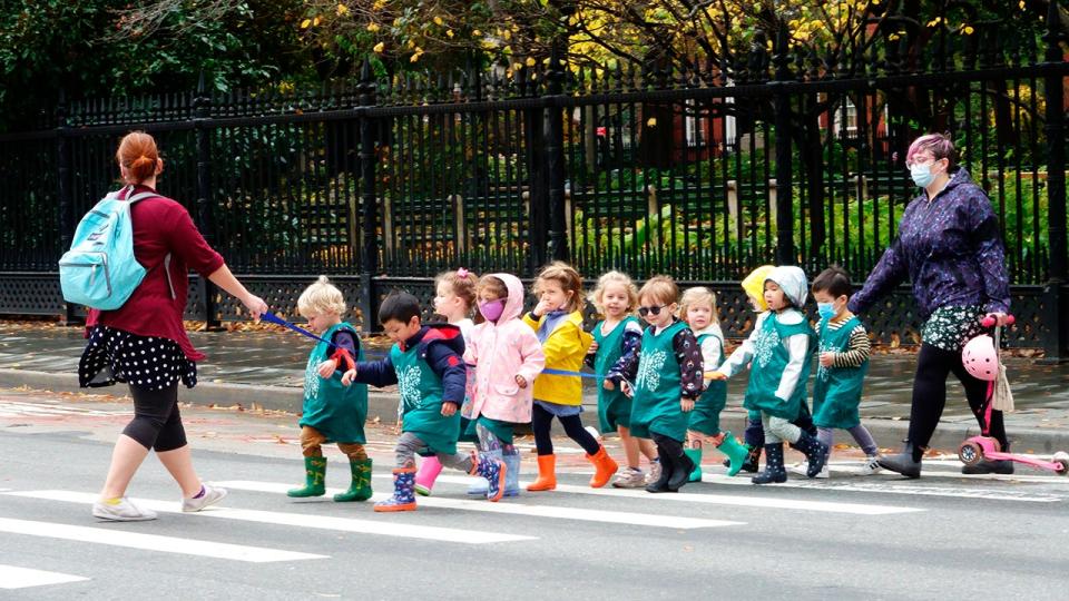 <div>Line of pre-school children crossing street with teacher. (Photo by: Joan Slatkin/Education Images/Universal Images Group via Getty Images)</div>