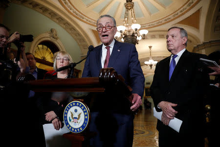 Senate Minority Leader Chuck Schumer, accompanied by Sen. Dick Durbin (D-IL) and Sen. Patty Murray (D-WA), speaks with reporters following the party luncheons on Capitol Hill in Washington, U.S. January 23, 2018. REUTERS/Aaron P. Bernstein