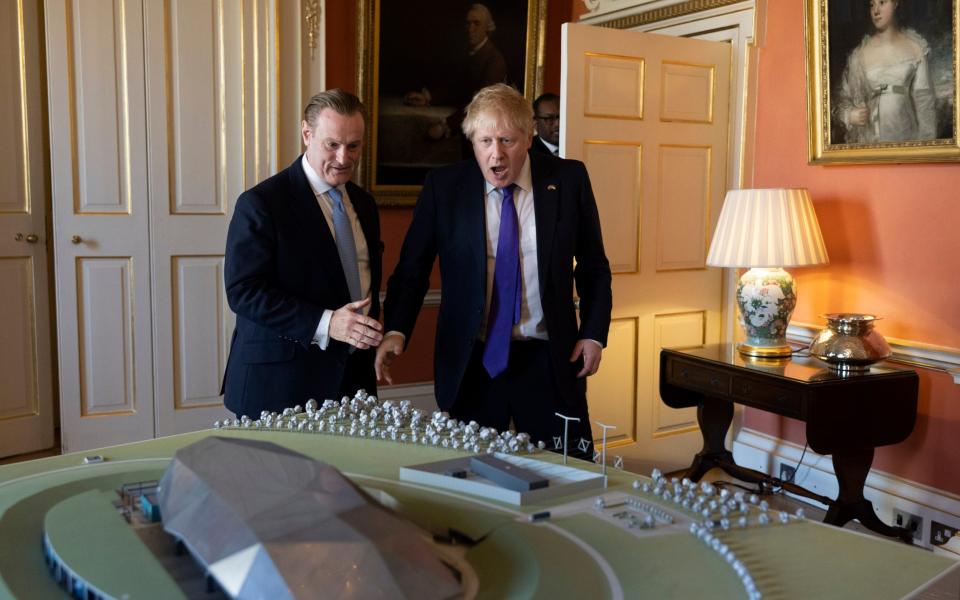 Boris Johnson, and Tom Samson of Rolls Royce SMR look at a model of a Rolls Royce Nuclear Power plant - Simon Dawson / No 10 Downing Street