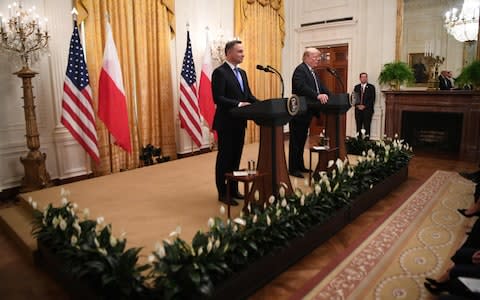 The scene in the White House for the joint press conference  - Credit:  Jim WATSON / AFP