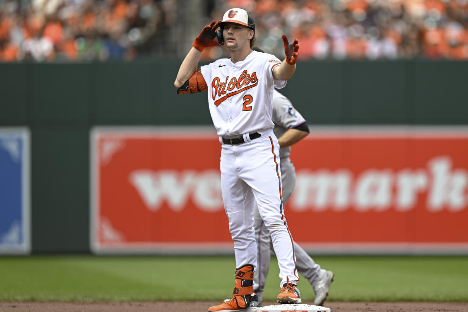 Baltimore Orioles' Gunnar Henderson (2) gestures after hitting a double against Miami Marlins relief pitcher George Soriano during the first inning of a baseball game, Sunday, July 16, 2023, in Baltimore. (AP Photo/Terrance Williams)