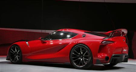 The Toyota FT-1 concept car is unveiled on stage during the press preview day of the North American International Auto Show in Detroit, Michigan January 13, 2014. REUTERS/Rebecca Cook