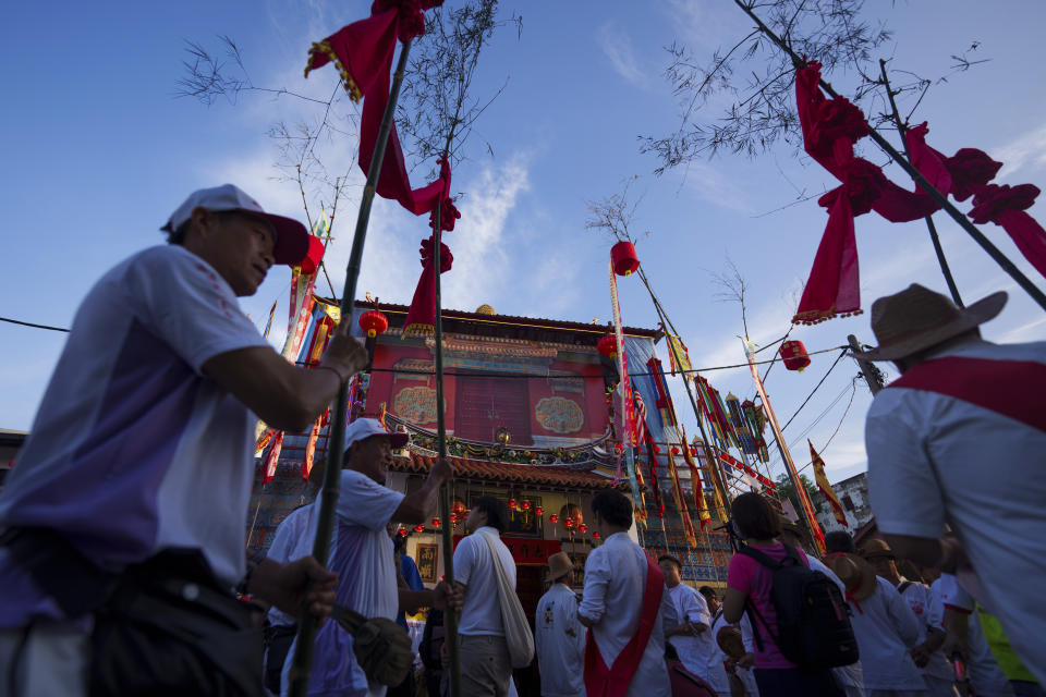 Ethnic Chinese devotees begin their 9 km procession during Wangkang or "royal ship" festival at Yong Chuan Tian Temple in Malacca, Malaysia, Thursday, Jan. 11, 2024. The Wangkang festival was brought to Malacca by Hokkien traders from China and first took place in 1854. Processions have been held in 1919, 1933, 2001, 2012 and 2021. (AP Photo/Vincent Thian)