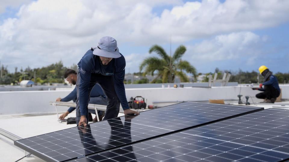 A solar worker installing rooftop solar panels on a home in Puerto Rico. Utilizing thousands of Sunrun solar-plus-storage systems, Puerto Ricans are contributing critical energy to the island’s troubled electrical grid, helping keep the lights on for all residents.