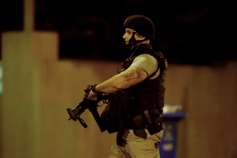 An armed police officer at the scene in the Melbourne bayside suburb of Brighton on June 5, 2017, after a woman was held against her will in an apartment block