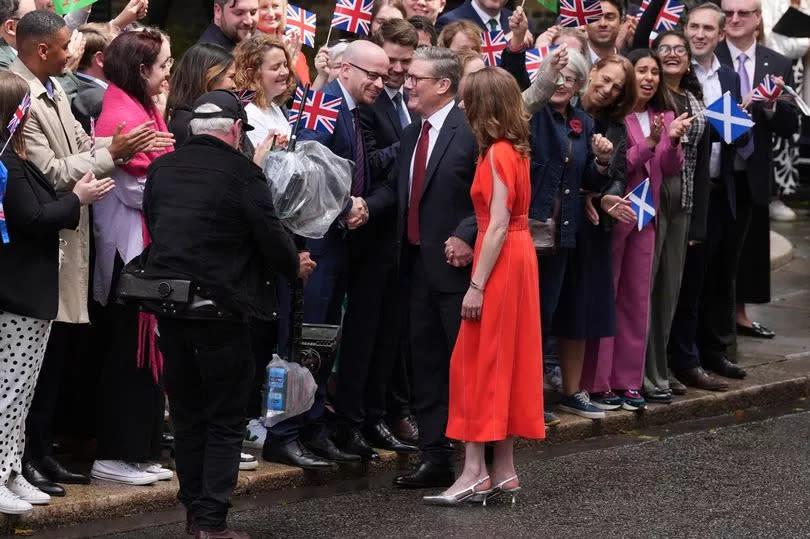 Sir Keir and his wife greet supporters in Downing Street