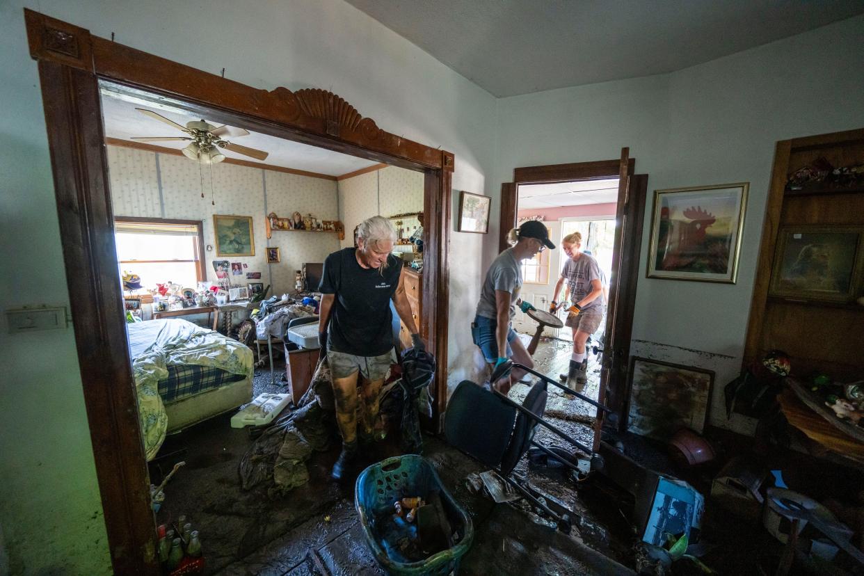 Family members help clean out Jerald Hoogendoorn's home in Rock Valley, Monday, June 24, 2024.