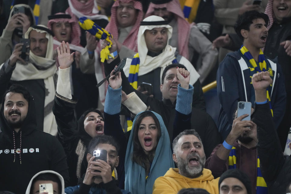 Fans react during official presentation of Cristiano Ronaldo as a new member of Al Nassr soccer club in in Riyadh, Saudi Arabia, Tuesday, Jan. 3, 2023.Ronaldo, who has won five Ballon d'Ors awards for the best soccer player in the world and five Champions League titles, will play outside of Europe for the first time in his storied career. (AP Photo/Amr Nabil)