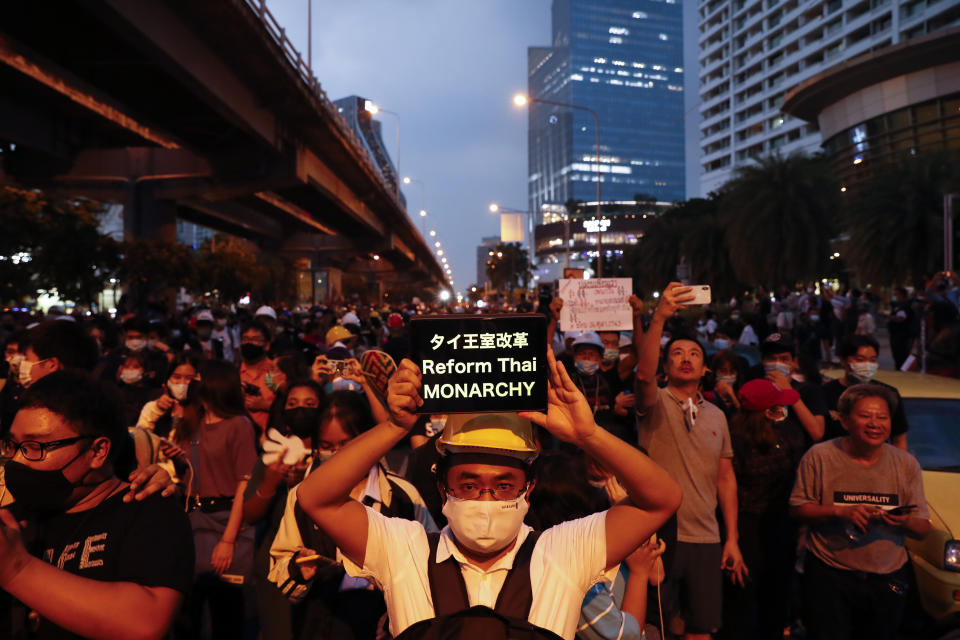 Pro-democracy demonstrators march to the German Embassy in central Bangkok, Thailand, Monday, Oct. 26, 2020. As lawmakers debated in a special session in Parliament that was called to address political tensions, the student-led rallies were set to continue with a march through central Bangkok on Monday evening to the German Embassy, apparently to bring attention to the time King Maha Vajiralongkorn spends in Germany. (AP Photo/Gemunu Amarasinghe)