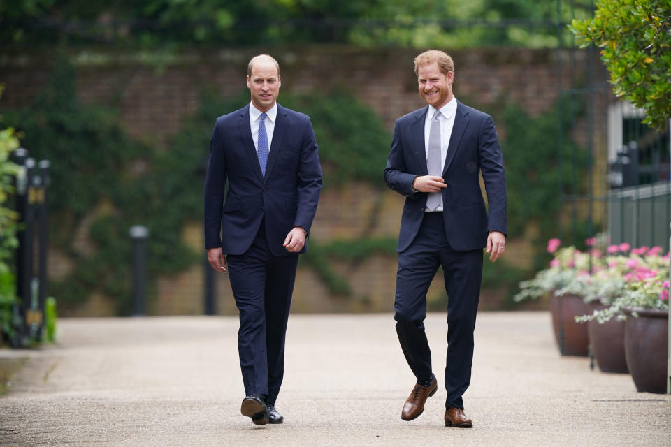 LONDON, ENGLAND - JULY 01: Prince William, Duke of Cambridge (left) and Prince Harry, Duke of Sussex arrive for the unveiling of a statue they commissioned of their mother Diana, Princess of Wales, in the Sunken Garden of Kensington Palace on what would have been her 60th birthday on July 1, 2021 in London, England. Today would have been the 60th birthday of Princess Diana, who died in 1997. At a ceremony here today, her sons Prince William and Prince Harry, the Duke of Cambridge and the Duke of Sussex respectively, will unveil a statue in her memory. (Photo by Yui Mok - WPA Pool/Getty Images)