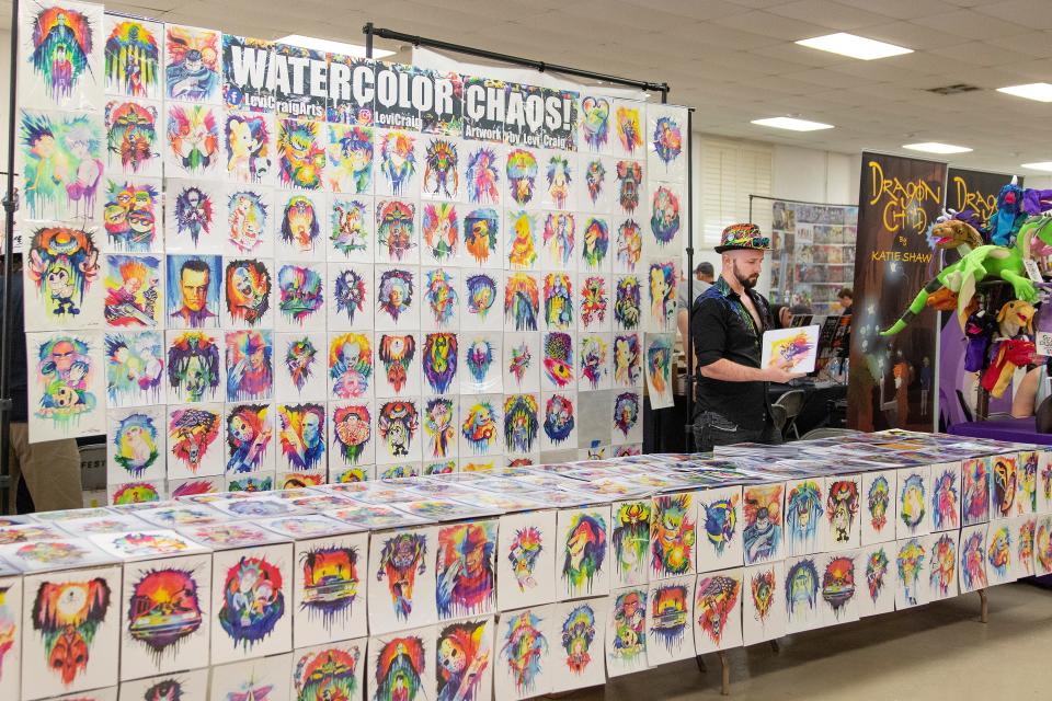 Levi Craig, from Lincoln, CA sells his hand painted water color chaos prints at the Lodi Comic Con at Lodi Grape Festival on May 8th. Dianne Rose/For The Record