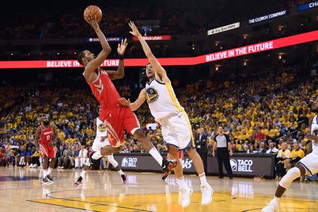 May 26, 2018; Oakland, CA, USA; Houston Rockets forward Trevor Ariza (1) shoots the ball against Golden State Warriors center JaVale McGee (1) during the second quarter in game six of the Western conference finals of the 2018 NBA Playoffs at Oracle Arena. Mandatory Credit: Kyle Terada-USA TODAY Sports