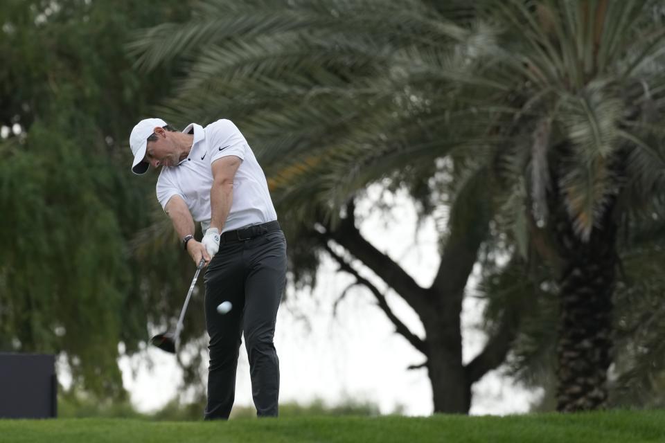 Rory McIlroy of Northern Ireland tees off on the 12th hole during the first round of the Dubai Desert Classic, in Dubai, United Arab Emirates, Thursday, Jan. 26, 2023. (AP Photo/Kamran Jebreili)