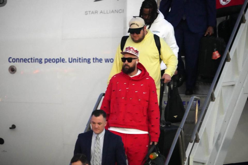 Feb 4, 2024; Las Vegas, NV, USA; Kansas City Chiefs coach tight end Travis Kelce exits plane during Super Bowl 58 team arrivals at the Harry Reid International Airport.