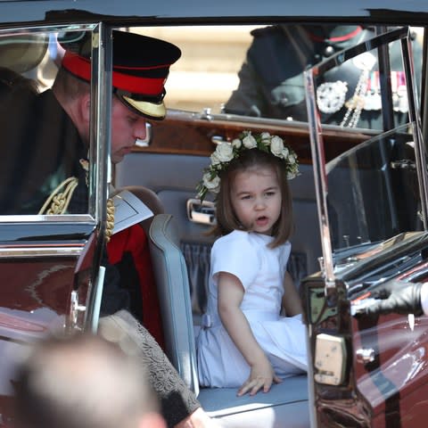 If you hadn’t been looking for her, you would have missed her entirely. Prince George and Princess Charlotte’s nanny blended expertly into the background in St George’s Chapel on Saturday, looking on from the sidelines as her little charges and their fellow bridesmaids and page boys performed their duties beautifully. But if Maria Borrallo hadn’t been present in the chapel, there is a chance the ceremony might not have gone quite so smoothly. Rehearsals for the big day had been shambolic, insiders say, with the children - the youngest of whom, Zalie, daughter of Prince Harry’s friend Jake Warren, was only two years old - proving impossible to keep in line. It was decided that the two eldest children, seven year-old twins Brian and John Mulroney, should be tasked with the important job of holding a corner each of the new Duchess of Sussex’s five metre-long train. Ms Borrallo became known as “the child whisperer” Credit: Max Mumby The boys are said to have been practising with a train (with mixed results) since Wednesday, learning how to keep the same pace as they walked down the aisle, when to pick up and put down the the hand-embroidered silk and organza veil - which had been sewn with flowers from each of the 53 Commonwealth nations - and just how high to hold it up. Would they step on it and tear it? Would they remember what to do when? Their mother, the Duchess’s best friend Jessica Mulroney, must have breathed a sigh of relief when her sons’ duties were finally done. One of the gap-toothed twins- Brian - stole the nation's hearts when he peeked out from behind the Duchess as she entered the chapel, his mouth dropping open in delight at the sight of 600 people waiting for him inside. It provided the perfect photo opportunity which his father, Ben Mulroney, has hinted may have earned him a special treat as a reward. "Ok, Brian," Mr Mulroney wrote on Instagram. "You're getting a TV in your room for the summer." The Mulroney twins had a crucial job at the wedding Credit: Owen Humphreys /PA While the boys were concentrating on their job, their little sister Ivy - along with Princess Charlotte, three, Prince George, four, Prince Harry’s godchildren Jasper Dyer, six, and Florence van Cutsem, three, and the Duchess’ goddaughters Rylan and Remi Litt, seven and six - were to wait in the wings before trotting after them down the aisle. On the day, it all became too much for little Zalie Warren, who had to be picked up and comforted by Prince George and Princess Charlotte’s nanny before she could make her way down the aisle, holding Princess Charlotte’s hand. Ms Borrallo, who has been with the family for four years now, was on hand to keep the children in check on Saturday, doing such a brilliant job that many of the parents in the congregation commented that she must be “magic”, and said they wanted to know “all her secrets”. By the end of the morning, she had become known as “the child whisperer”, so adept was Ms Borrallo at keeping the children quiet and happy in the midst of the pomp and circumstance which threatened to overwhelm them. Princess Charlotte and the other children were reportedly pacified with promises of smarties Credit: Jane Barlow/PA Her secret? An insider says one of the techniques the Norland Nanny employed to get the children to stand nicely was the promise of Smarties. And who could blame her? What little person wouldn’t behave with the possibility of handful of Smarties hanging in the balance? Whatever her technique, it seems to have worked - all ten children executed their role beautifully. Usually sporting the traditional Norland uniform of a brown fifties-style nurse’s dress, white gloves, brown brogues and a little brown bowler hat, Ms Borrallo was able to blend into the background on Saturday in a simple navy dress, eschewing her uniform for the day - only a discreet badge with the Norland motto “Love Never Faileth” giving her away. Ms Borrallo, who was appointed by the Duke and Duchess in 2014, when Prince George was just eight months old, has often been called upon to be on hand at royal occasions, in case one of the children needs to be looked after. She lives with the family at Kensington Palace, and travels with them on royal tours and excursions. Ms Borrallo usually wears a brown nurse's style dress Credit: Max Mumby /Getty Norland Nannies are highly accomplished - they have to be adept at everything from sewing and cooking to self defence. The Duchess of Cambridge has said of her in the past she is “amazing”. Ironically, when the Duke of York married Sarah Ferguson in 1986, a young Prince William was such a badly behaved page boy (he refused to remain still while the couple exchanged vows, and stuck his tongue out at the flower girls), that his nanny was replaced following the wedding. His children's nanny will have been invaluable to his family in the past month as they have been adjusting to life with their new arrival, Prince Louis. A look back at royal bridesmaids and pageboys Super nanny Kathryn Mewes explains: “Norlanders don’t just consider the children, they consider the father and mother, too. “They are aware of the sensitivities of breastfeeding and sleeplessness, and they allow the mum to focus on the newborn while keeping the other children stable, secure and happy.” She certainly performed her duties admirably on Saturday. In fact, Her Royal Highness ought to watch out, after Ms Borrallo’s performance in the chapel, she could be getting a call from one or two Hollywood mothers in the coming days. Royal wedding | Read more 