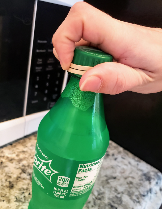 rubber band over the bottle cap