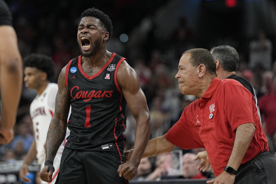 Houston guard Jamal Shead celebrates after scoring with head coach Kelvin Sampson