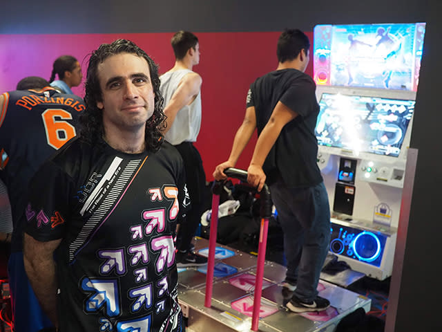 Even in a packed arcade, David Maiman stands out from the crowd. He's wearing