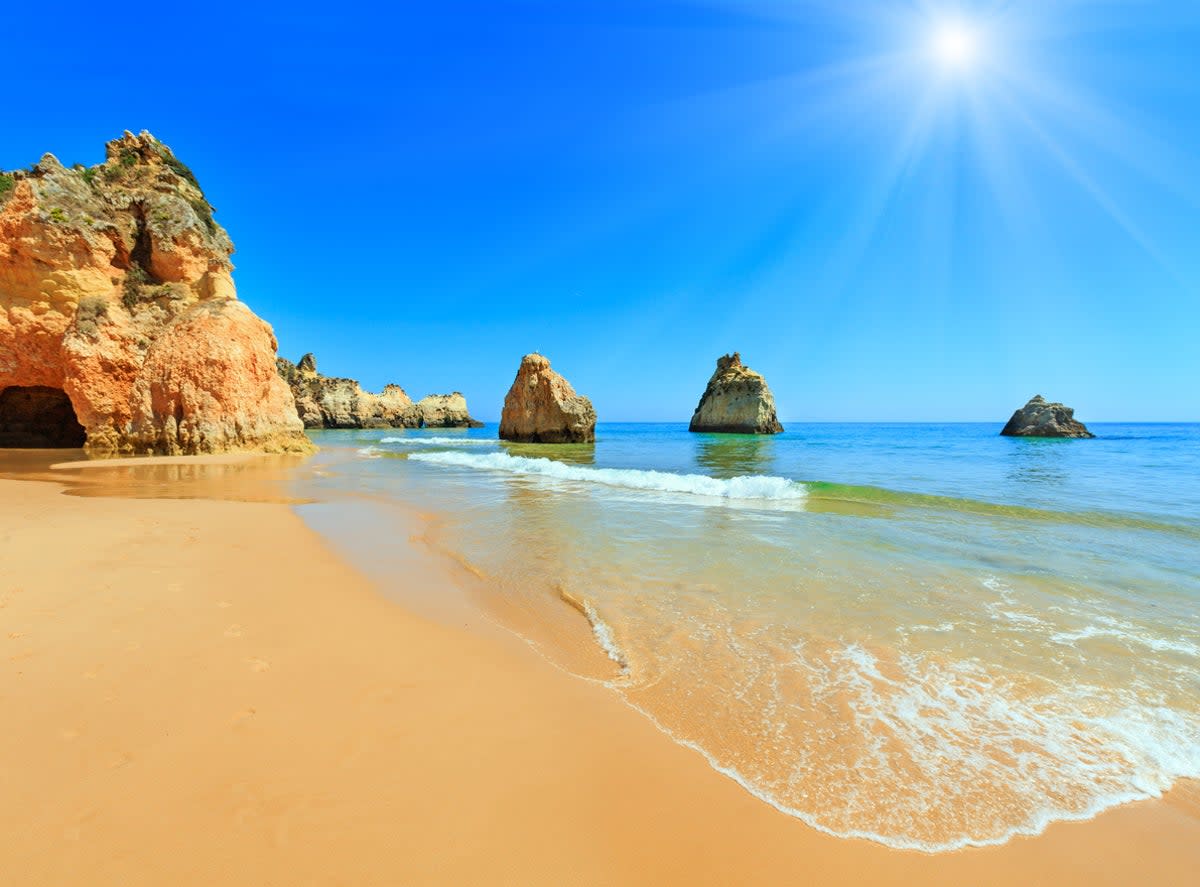 Visit the caves in Carvoeiro and walk along the Praia de Marinha cliffs (Getty Images/iStockphoto)