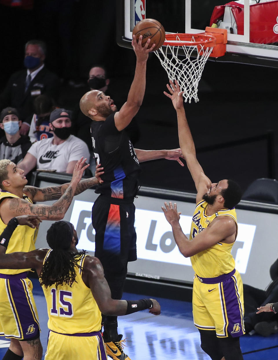 New York Knicks center Taj Gibson (67) puts back an offensive rebound against the Los Angeles Lakers in the second quarter of an NBA basketball game at Madison Square Garden in New York, Monday, April 12, 2021. (Wendell Cruz/Pool Photo via AP)