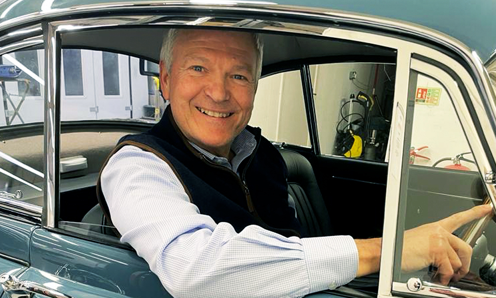 Basis Technologies CEO and classic car lover Martin Metcalf with his restored 1959 Jaguar XK150. Photo: Supplied