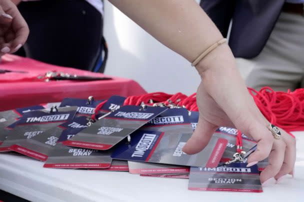 A campaign staffer organizers credentials for the presidential campaign launch of Sen. Tim Scott. Scott formalized his campaign last week and held an official announcement event at , Charleston Southern University, May 22, 2023, in North Charleston, S.C. (Meg Kinnard/AP)