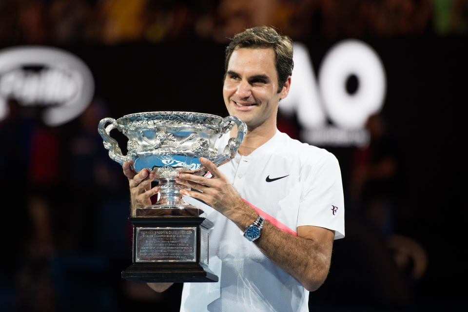 Roger Federer holding the mens 2018 Australian Open Trophy on January 26th 2018 in Melbourne, Australia.