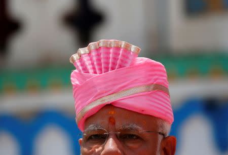 India's Prime Minister Narendra Modi is pictured wearing a traditional Maithili turban during his visit at Janaki Mandir, a Hindu temple dedicated to goddess Sita, in Janakpur, Nepal May 11, 2018. REUTERS/Navesh Chitrakar