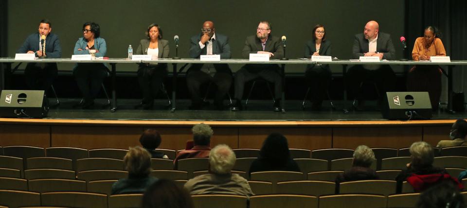 School board candidates, from left, Patrick Bravo, Gwen Bryant, Summer L. Hall, Myron L. Lewis, Keith Mills, Rene Molenaur, Phil Montgomery and Barbara Sykes take part in the Akron City School Board Candidate Forum at the Akron-Summit County Library in Akron.