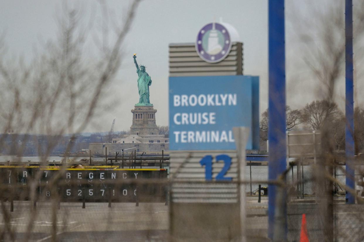 On a wintry day, the Statue of Liberty can be seen standing tall, from Brooklyn Cruise Terminal 12.