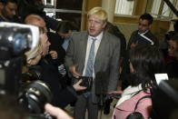 FILE - Conservative Member of Parliament and editor of The Spectator magazine, Boris Johnson arrives at the Liverpool Institute of Performing Arts in Liverpool, England, Wednesday Oct. 20 2004. He is visiting the city to apologise to the people after he accused them of being 'hooked on grief' following their reactions to the murder of Iraq hostage Kenneth Bigley earlier in October and the Hillsborough soccer disaster of 1989 which claimed the lives of 96 Liverpool soccer fans. (AP Photo/Paul Ellis, File)