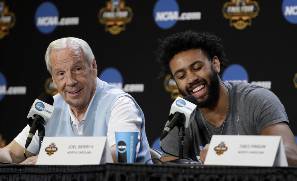 North Carolina head coach Roy Williams, left, and Joel Berry II laugh during a news conference for the Final Four NCAA college basketball tournament, Sunday, April 2, 2017, in Glendale, Ariz. (AP Photo/Mark Humphrey)