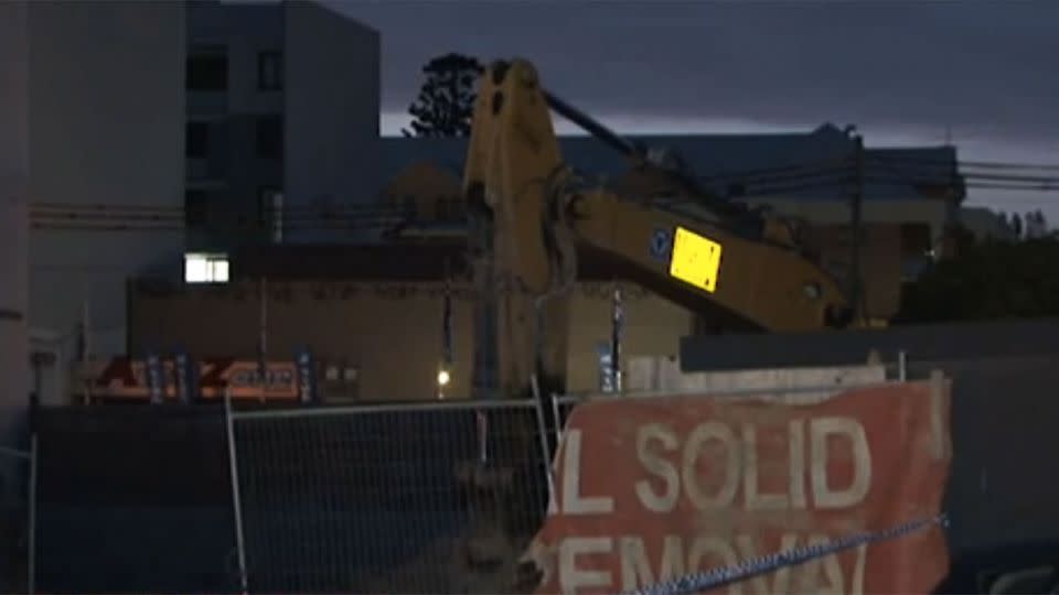 A body showing no signs of life was found in the bucket of an excavator at Homebush. Photo: 7 News