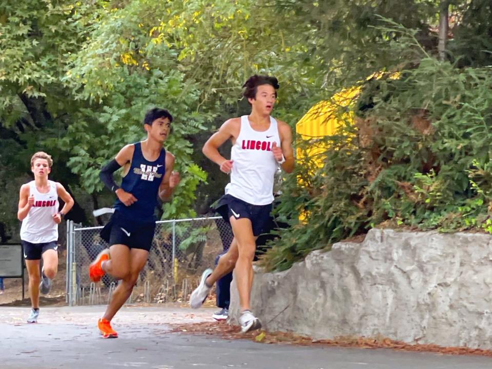 Lincoln's Jeffrey Overgaard runs in a long distance race during one of the Trojans' track meets during the 2022-23 season.