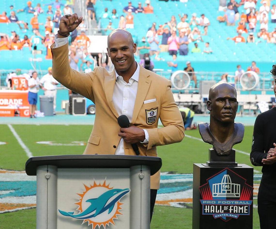 Former Miami Dolphins Jason Taylor with his Hall of Fame bust at a half time ceremony as the Fins play the Denver Broncos at Hard Rock Stadium in Miami Gardens, Florida, Dec. 3, 2017.
