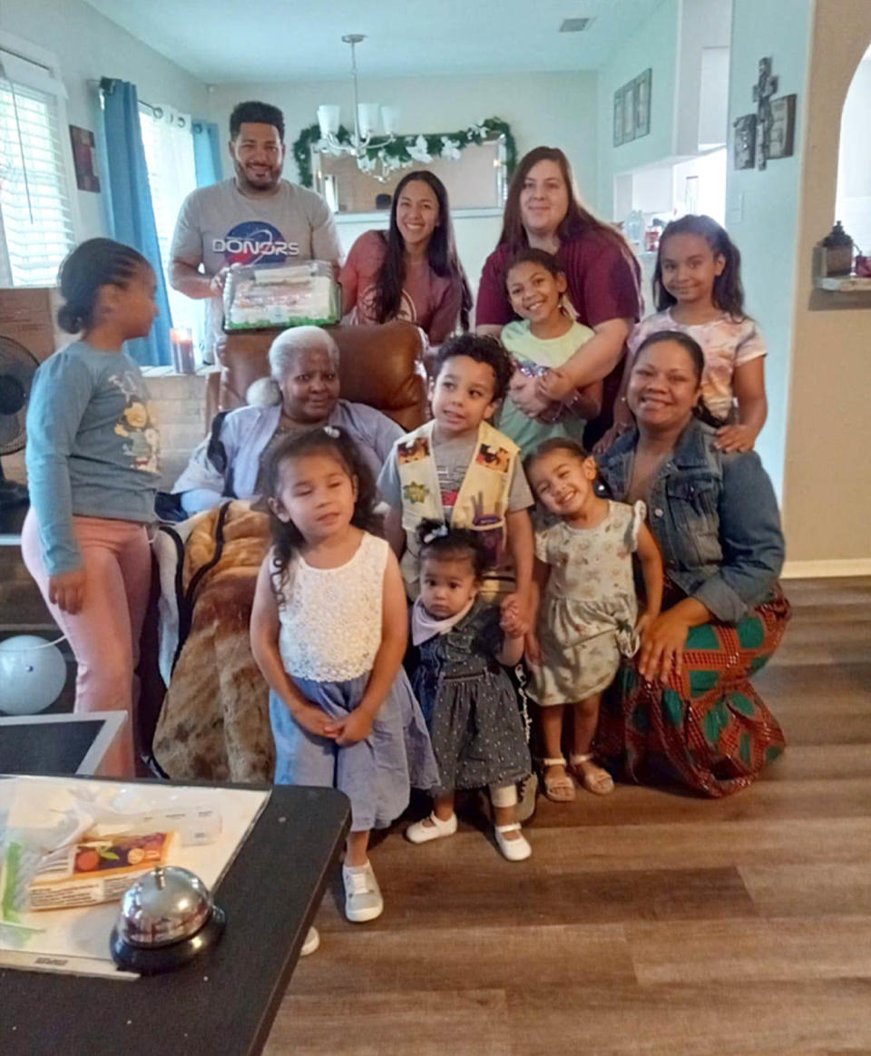 Pamela Jarrett, seated, with her family.  (Courtesy Janet Jarrett)