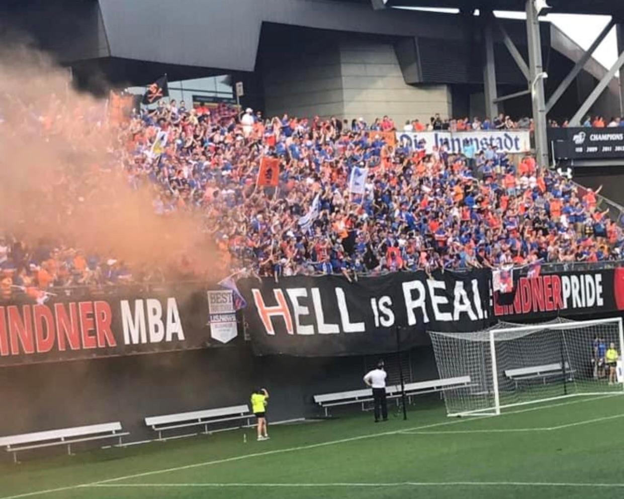 A u0022Hell is Realu0022 fan-painted sign at the 2017 Lamar Hunt U.S. Open Cup match between FC Cincinnati and the Columbus Crew. A rivalry game name was born that day.